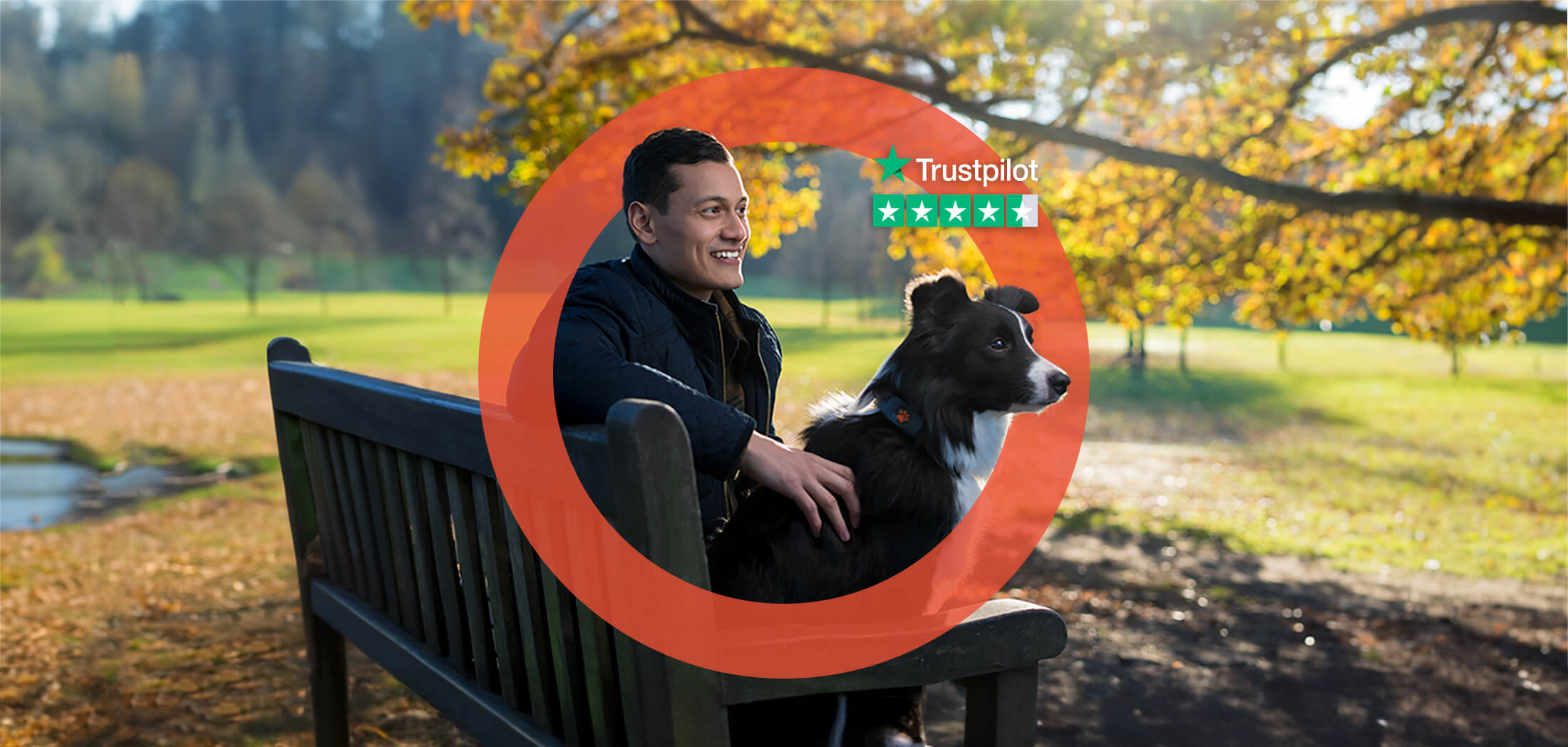 Dog and owner sitting on a bench in the park with PitPat's hug around them